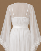 Close-up back view of the AHLAM bridal set showing the satin underdress straps, sheer tulle kimono and embellished sleeves
