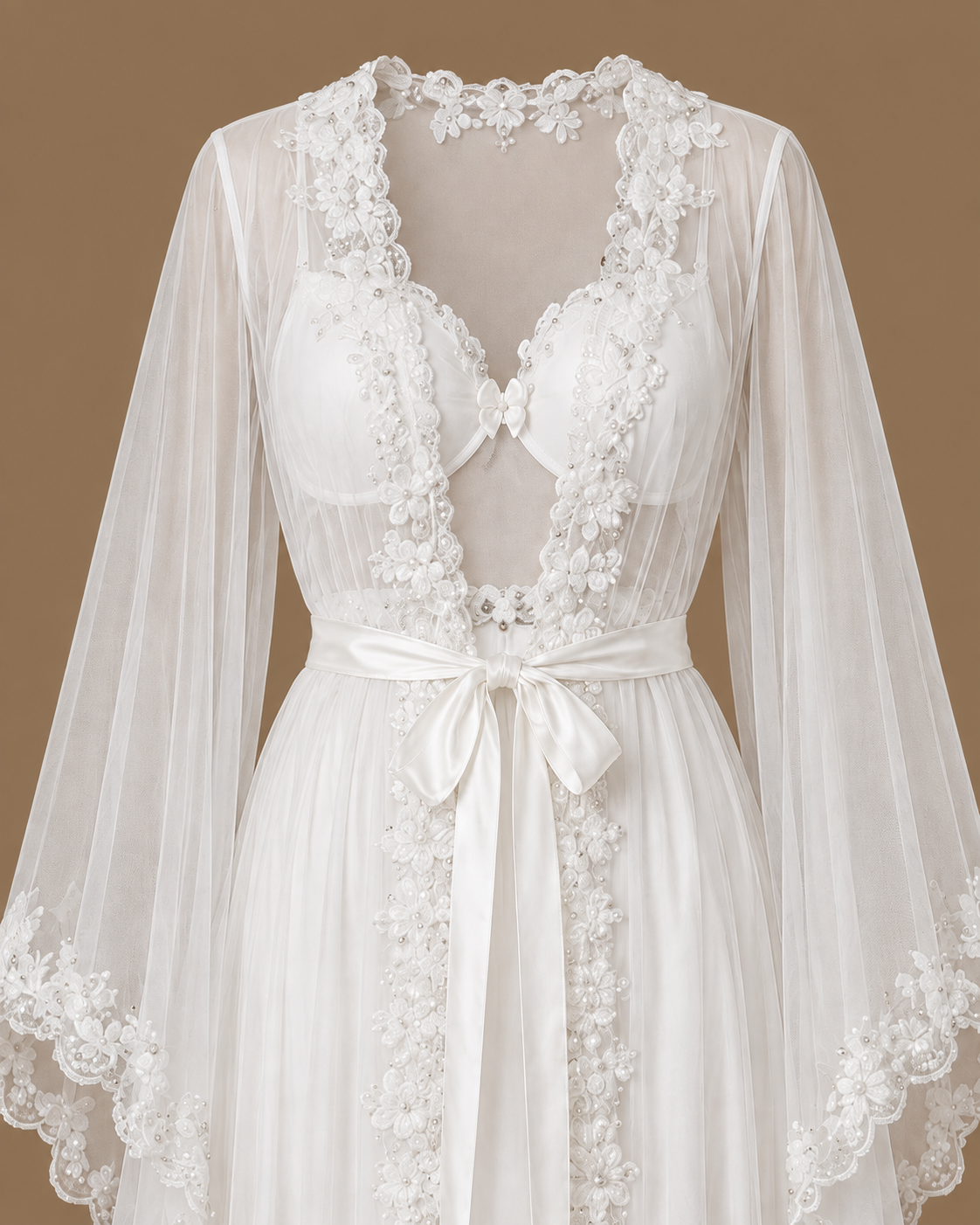 Close-up front view of the AHLAM ivory bridal set showing floral beadwork, sheer tulle sleeves and a satin tie belt