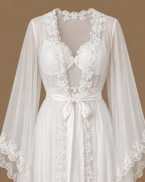 Close-up front view of the AHLAM ivory bridal set showing floral beadwork, sheer tulle sleeves and a satin tie belt