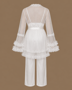 Back view of the CHAIMAE ivory bridal lounge set with a sheer tulle top, ruffled sleeves and satin trousers