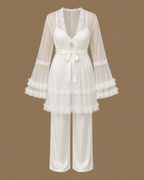 Front view of the CHAIMAE ivory four-piece bridal lounge set with a sheer tulle top, ruffled sleeves and satin trousers