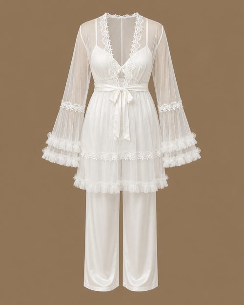 Front view of the CHAIMAE ivory four-piece bridal lounge set with a sheer tulle top, ruffled sleeves and satin trousers