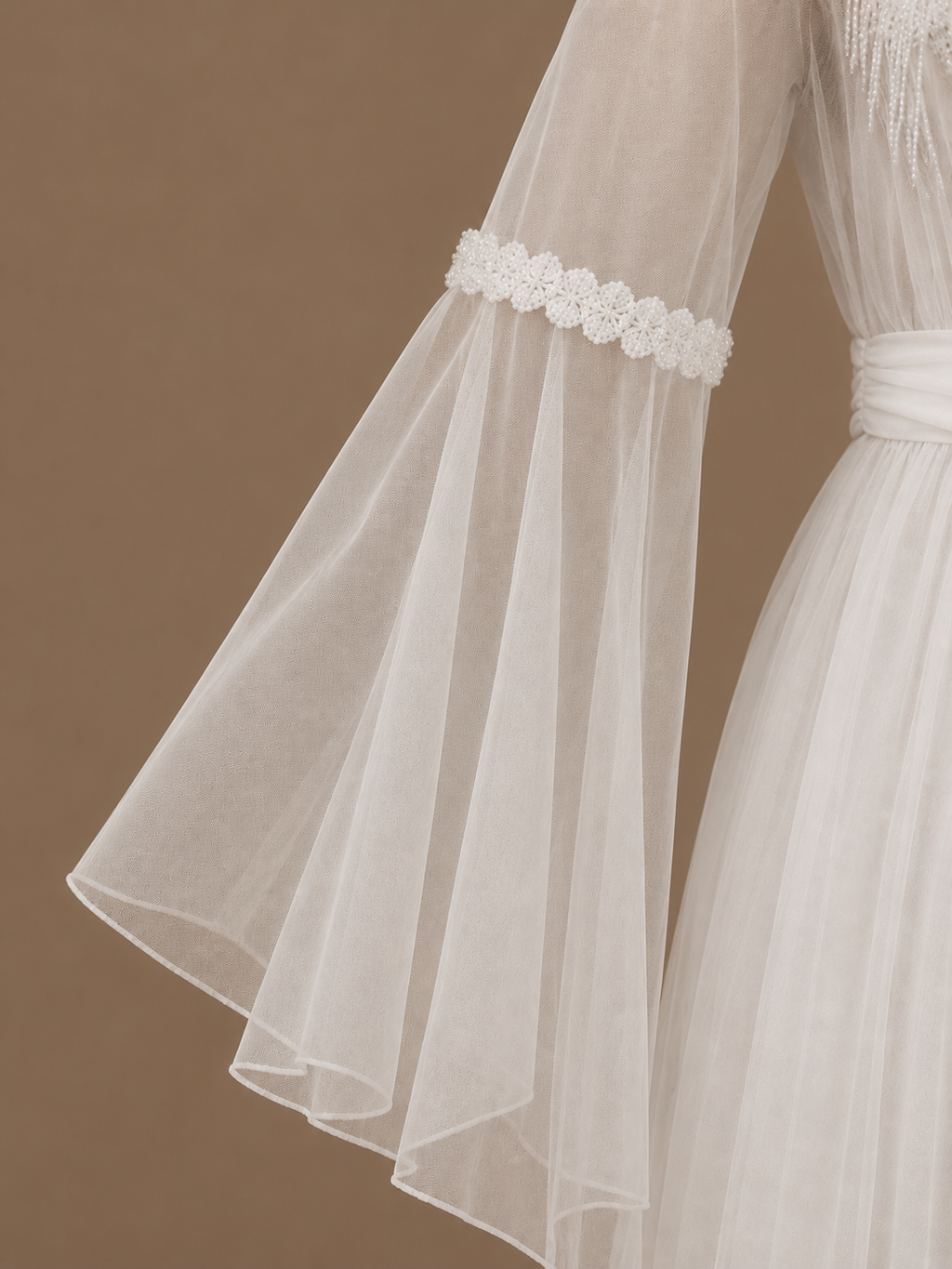Sleeve detail of the NOUR ivory bridal set with flowing sheer tulle and floral trim