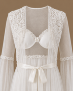 Front detail of the NOUR ivory bridal set with floral embroidery and cascading beaded fringe