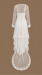 Back view of the SABAH ivory four-piece bridal set with layered sheer tulle, lace detailing and a subtle train