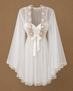 Front view of the SABRINE ivory bridal set with satin dress, sheer tulle kimono and pastel floral details